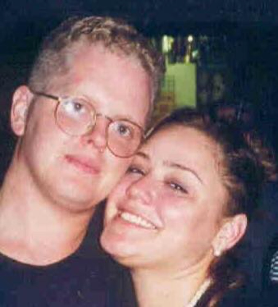 Faye and Jim cheek to cheek in an early married photo