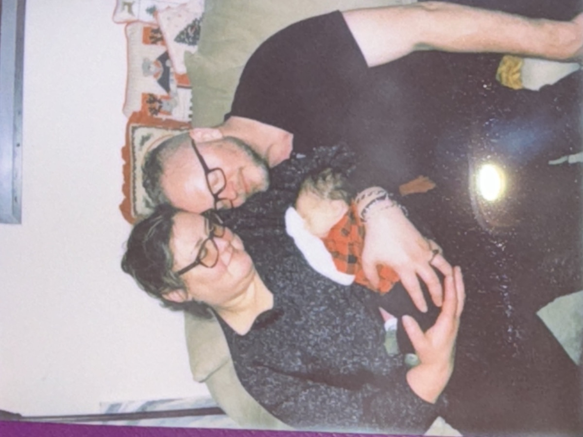 Faye and Jim holding their new grandson