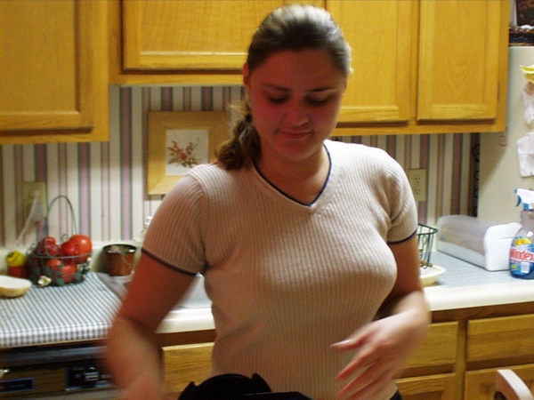 Faye in a tan shirt in the Stumberg Lane apartment kitchen