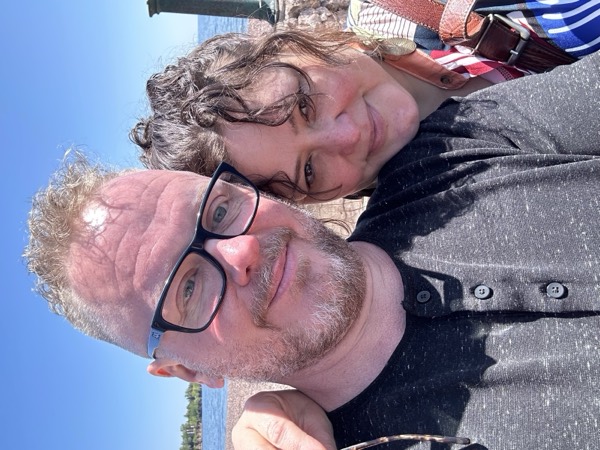 Sunny selfie of Faye and Jim on the Lake Superior shore in Duluth