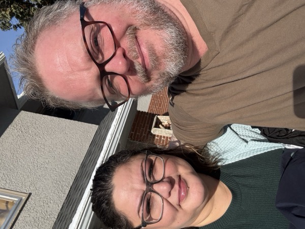Faye and Jim in bright winter sunshine at home